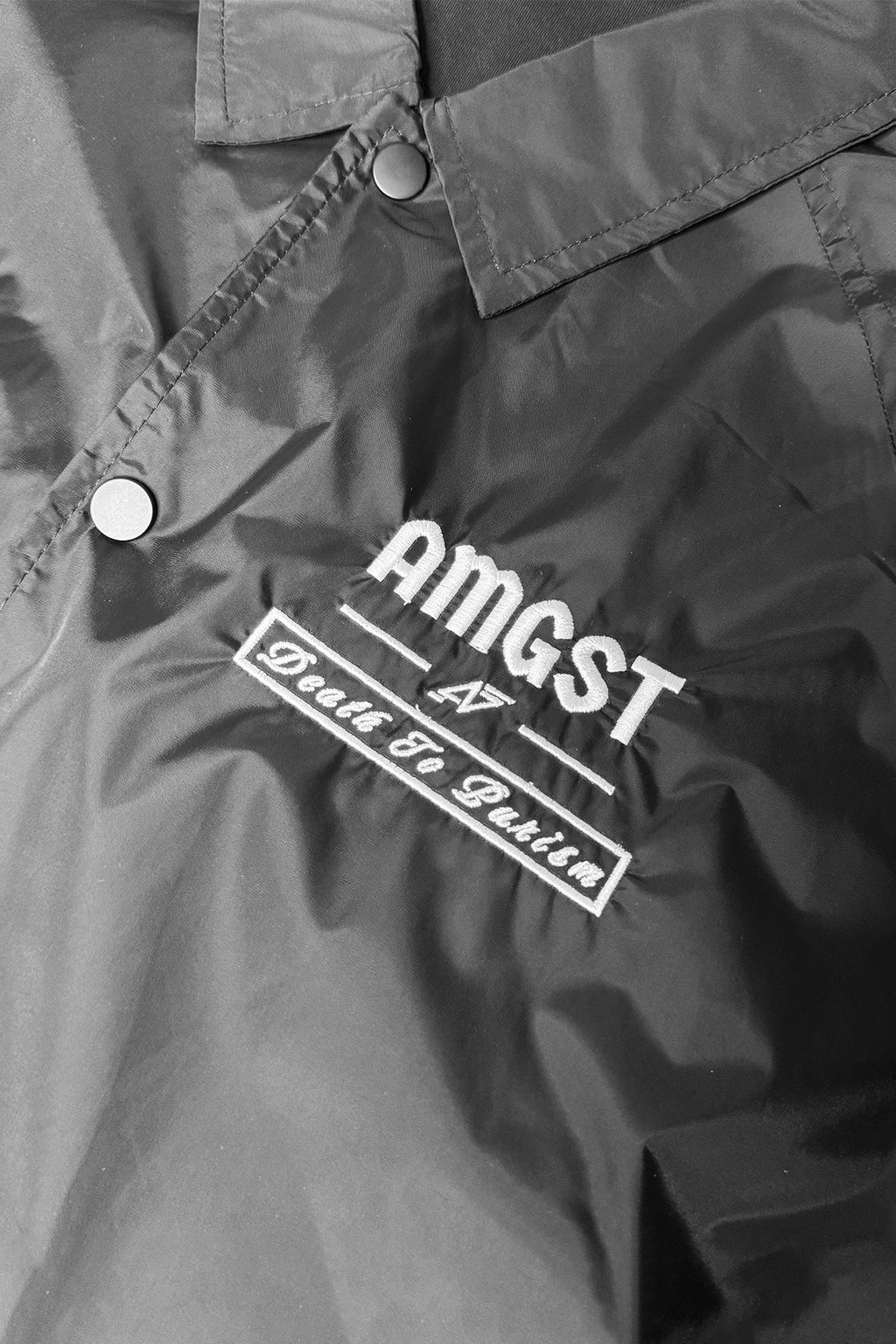 Amongst Giants Affiliate jacket close view showing embroidered logo. & design. 